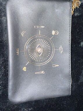 Black Cosmetic Pouch with Gold Symbol Accent